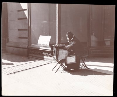 A blind street musician, New York by Byron Company